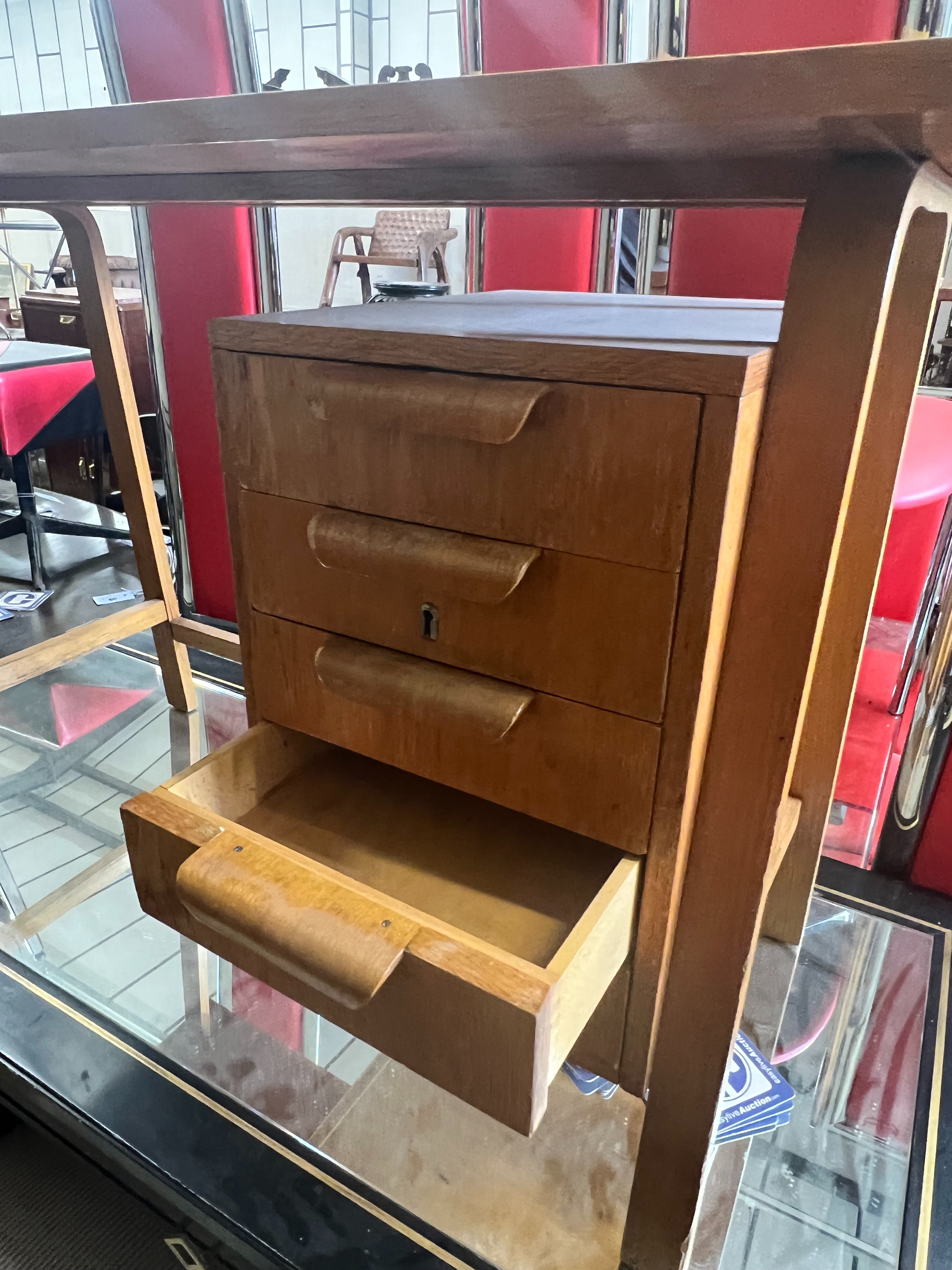 A Gordon Russell teak desk, width 99cm, depth 44cm height 69cm